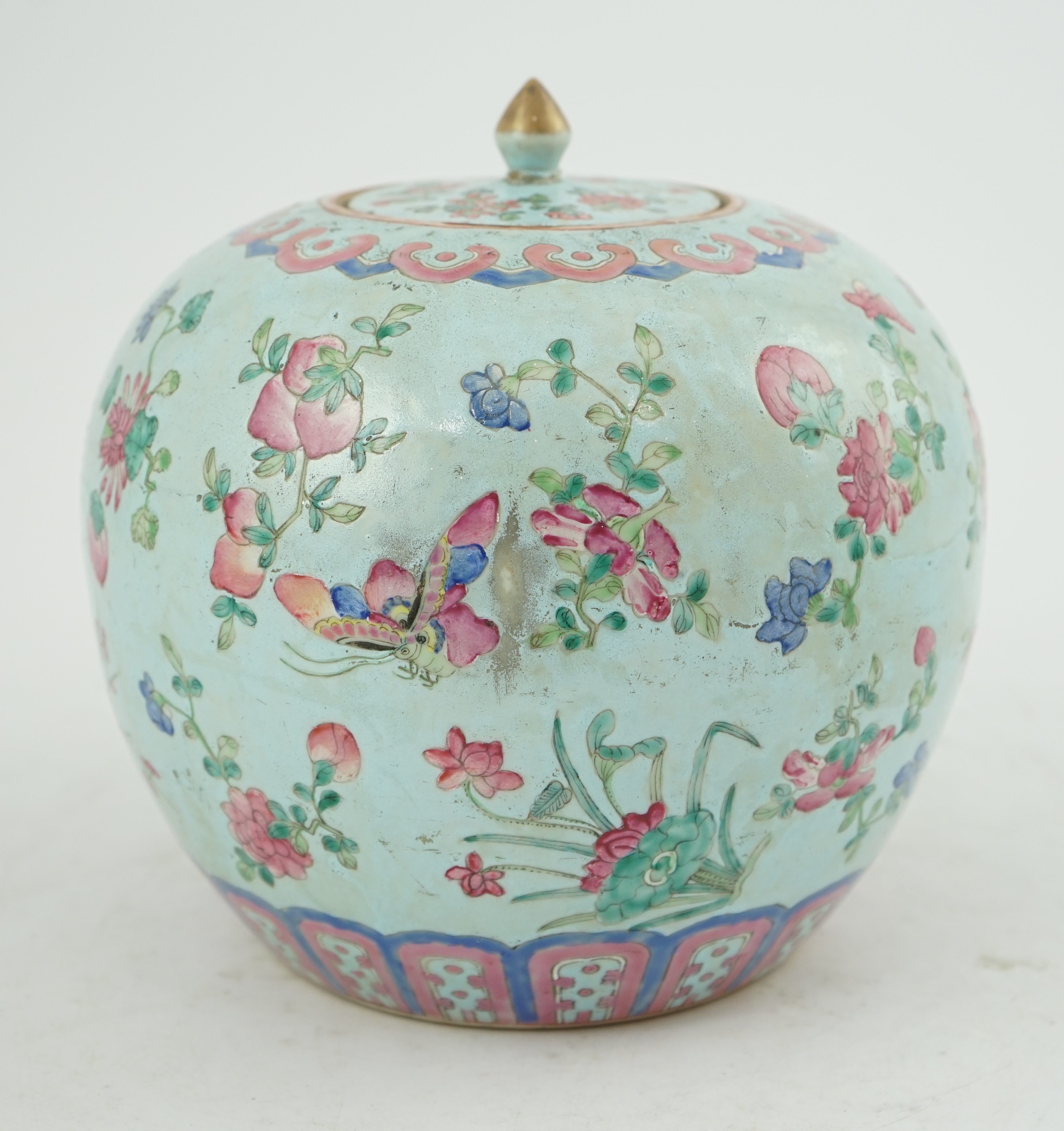 A Chinese turquoise ground famille rose jar and cover, late 19th century